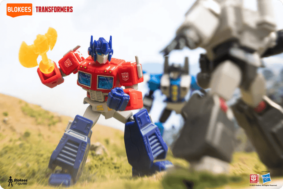 Blokees Transformers Galaxy Version featuring Optimus Prime in action with an energy axe, battling Megatron on a scenic outdoor backdrop.