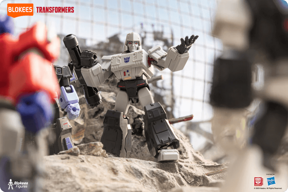 Blokees Transformers Galaxy Version showcasing Megatron leading a battle scene with Optimus Prime and others in a rocky, post-apocalyptic setting.