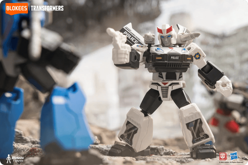 Blokees Transformers Galaxy Version featuring Prowl, the police-inspired Autobot, pointing dynamically in a detailed battle scene.